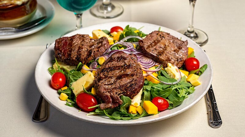 Sliced filet mignon salad